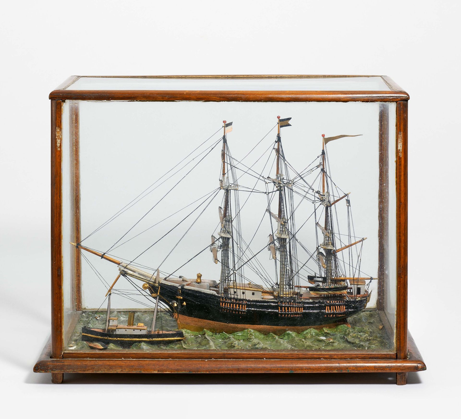 Null SHIP MODEL IN GLASS CASKET. 

Date: 20. Century. 
Technique: Various materi&hellip;