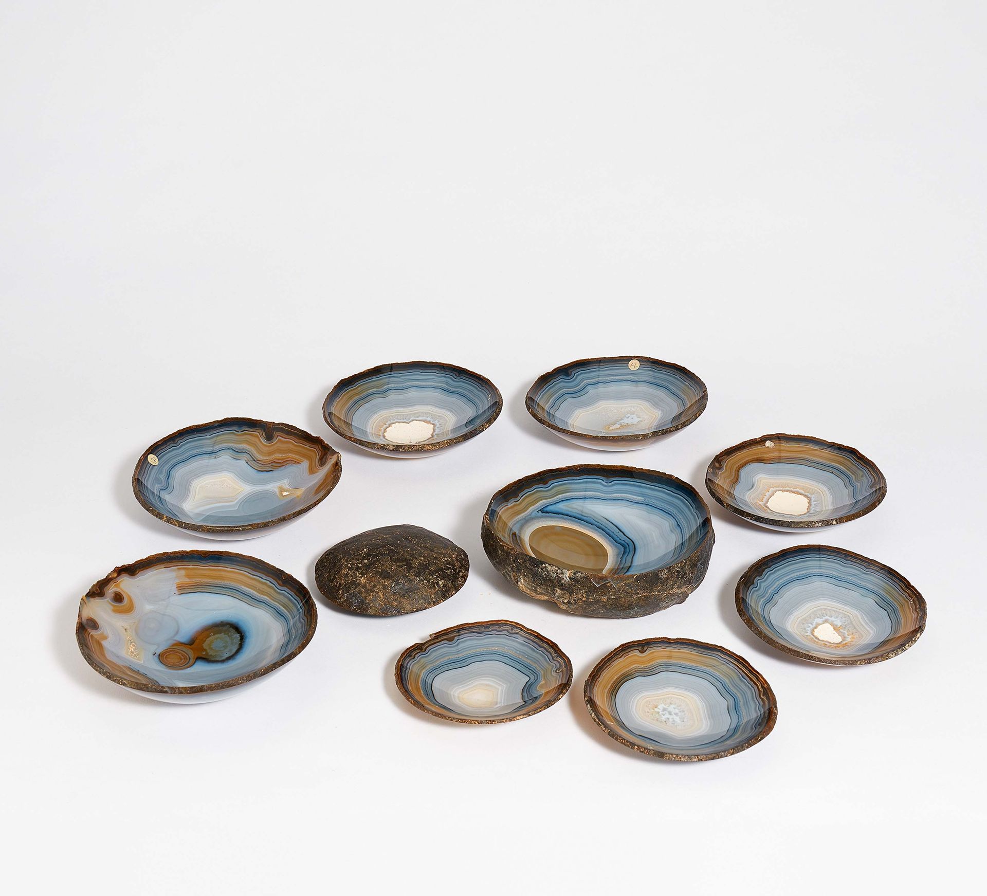 Null SUITE OF 9 AGATE BOWLS CUT FROM A GEODE. 

Technique: Agate in blue grey sh&hellip;