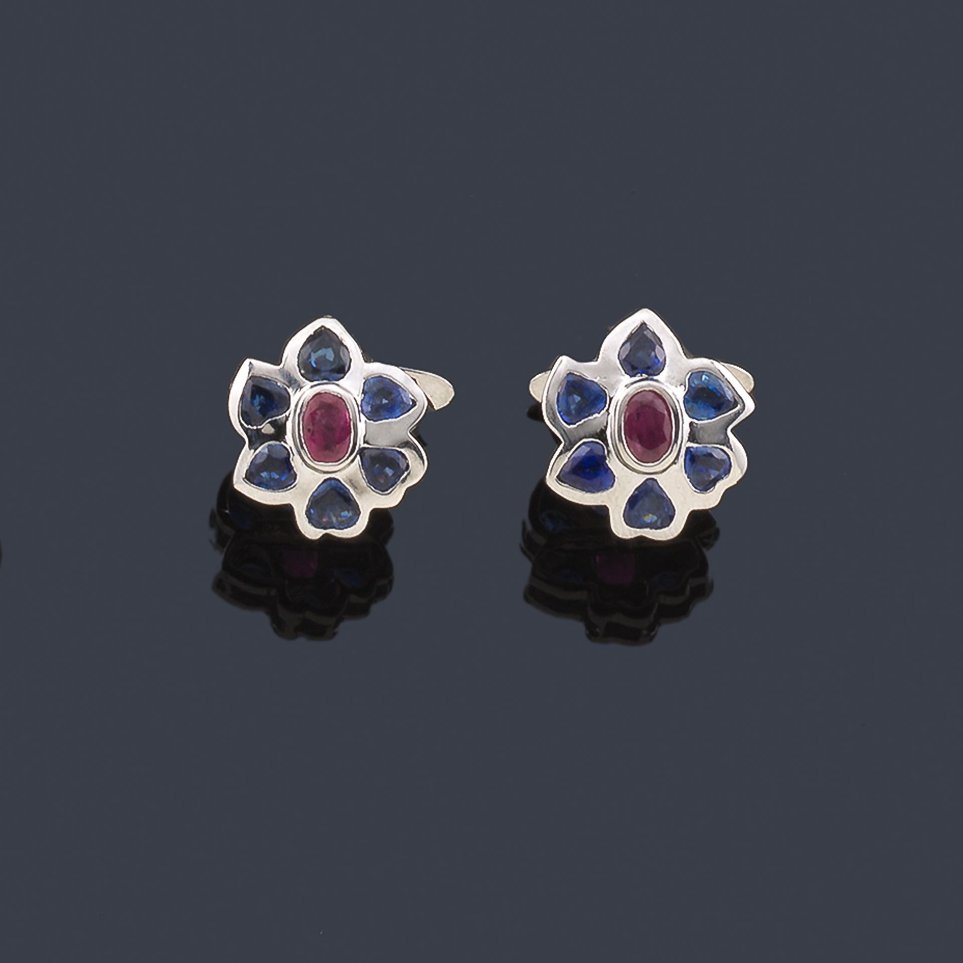 Cufflinks with a floral design with a pair of rubies and a border of sapphires o&hellip;