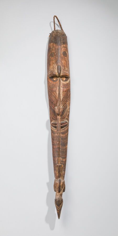 Null Mwei mask with elongated face, where the nose joins the chin to end with a &hellip;