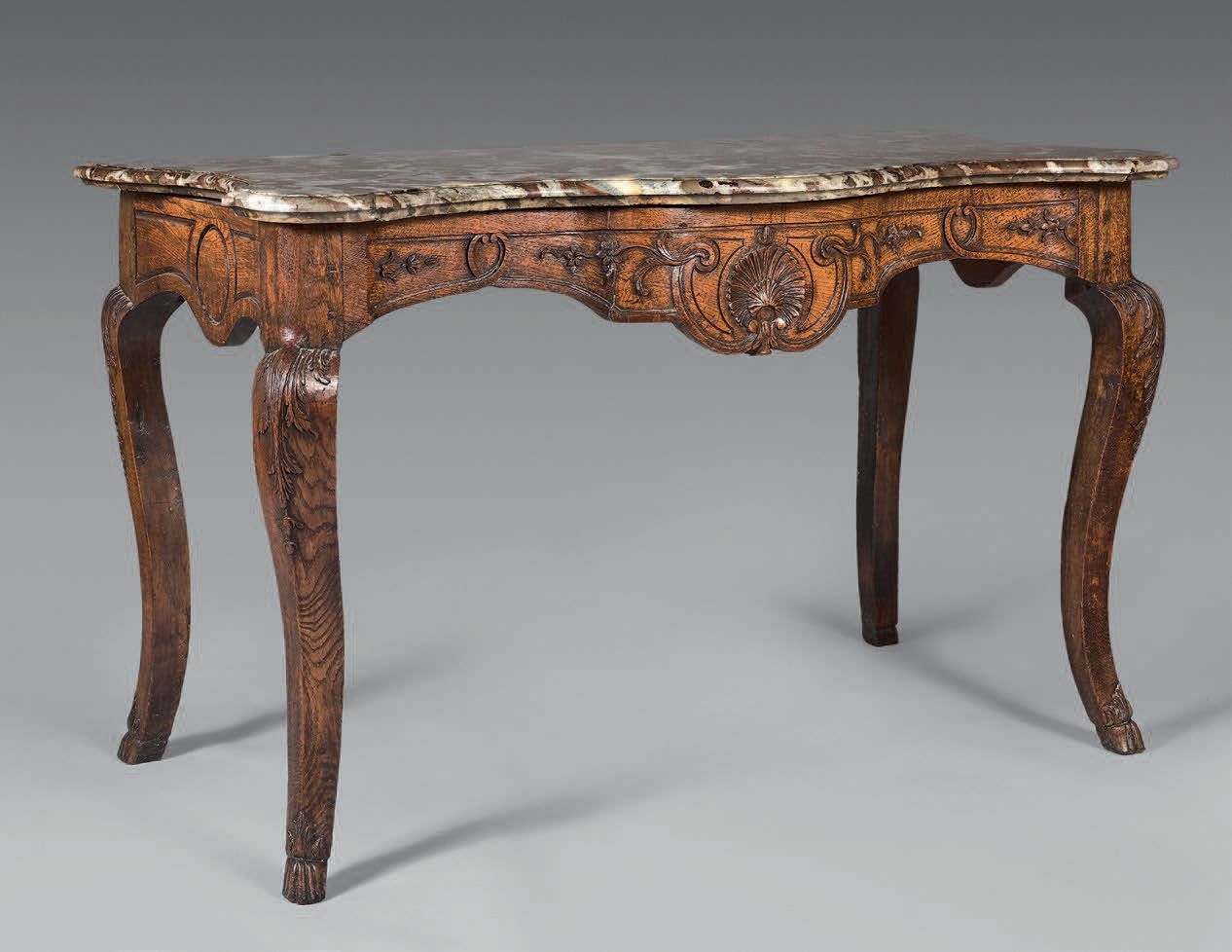 Null Carved and molded oak console. The curved belt decorated with a shell on th&hellip;