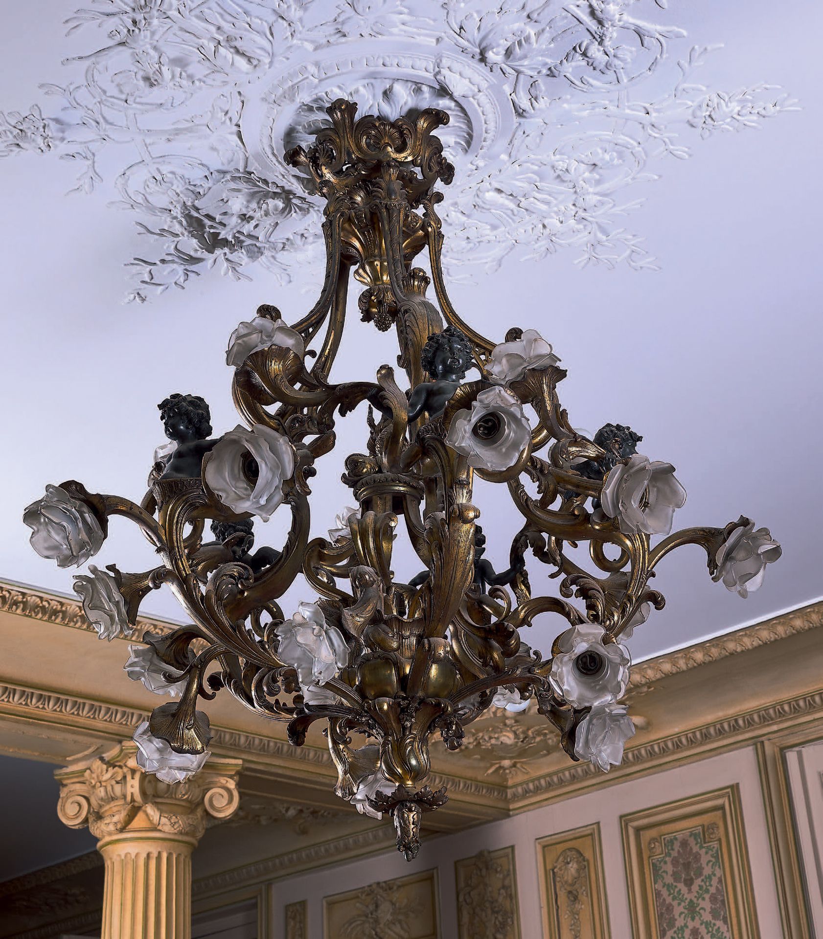 Null A large ormolu and patinated chandelier decorated with leafy scrolls. In th&hellip;