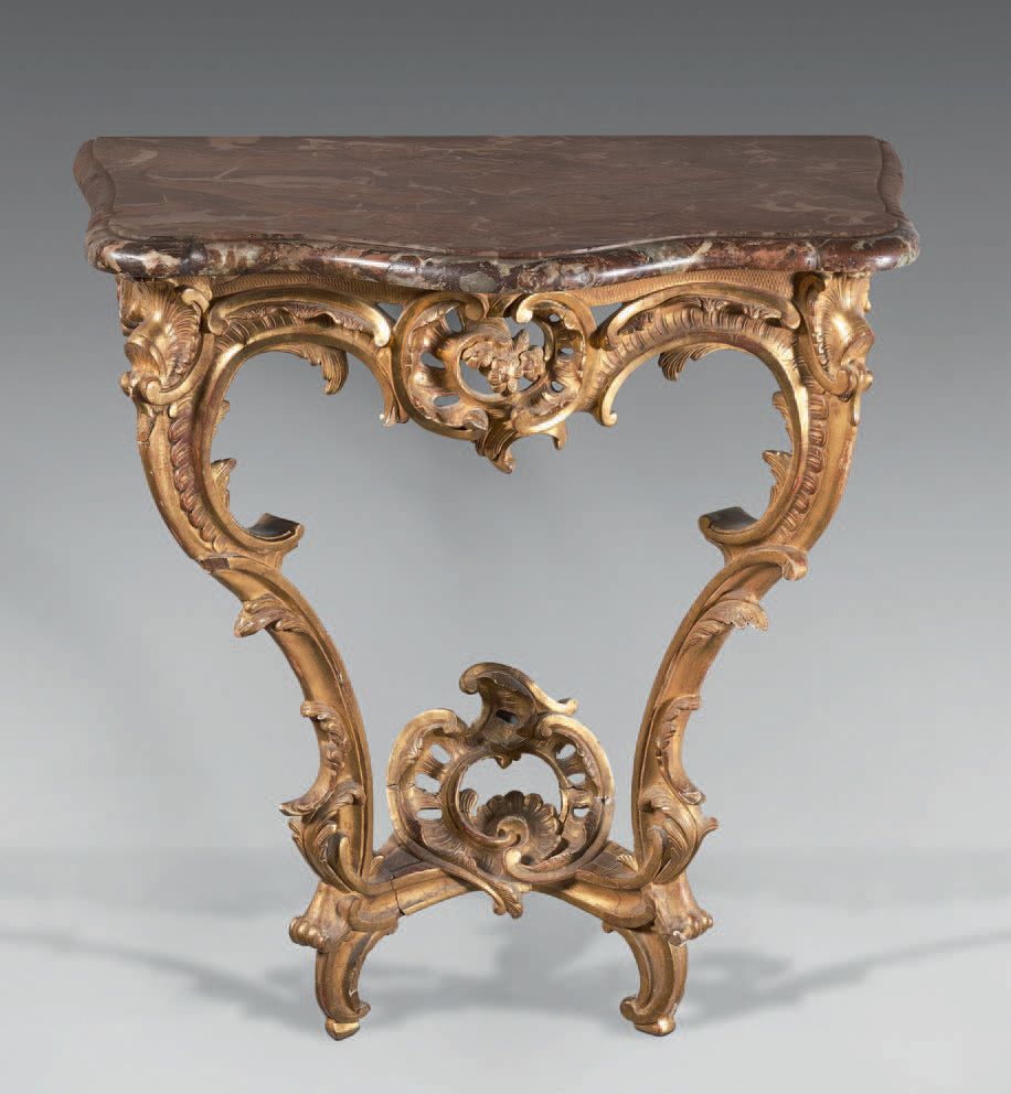 Null Small gilded and carved wood console, the belt pierced with a flowery carto&hellip;