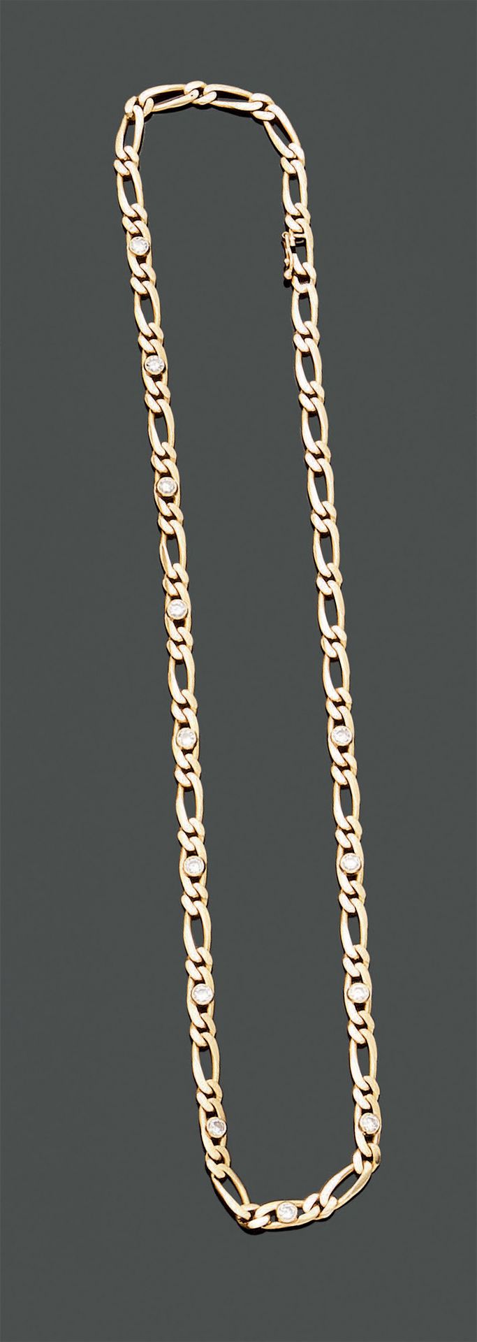 Null Chain in 18K (750) yellow gold, with a figaro link decorated with thirteen &hellip;