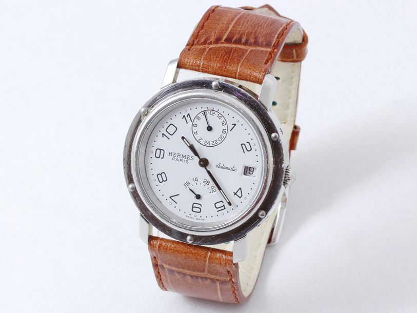 Null HERMÈS. Montre bracelet d’homme en acier, cadran blanc avec chiffres arabes&hellip;