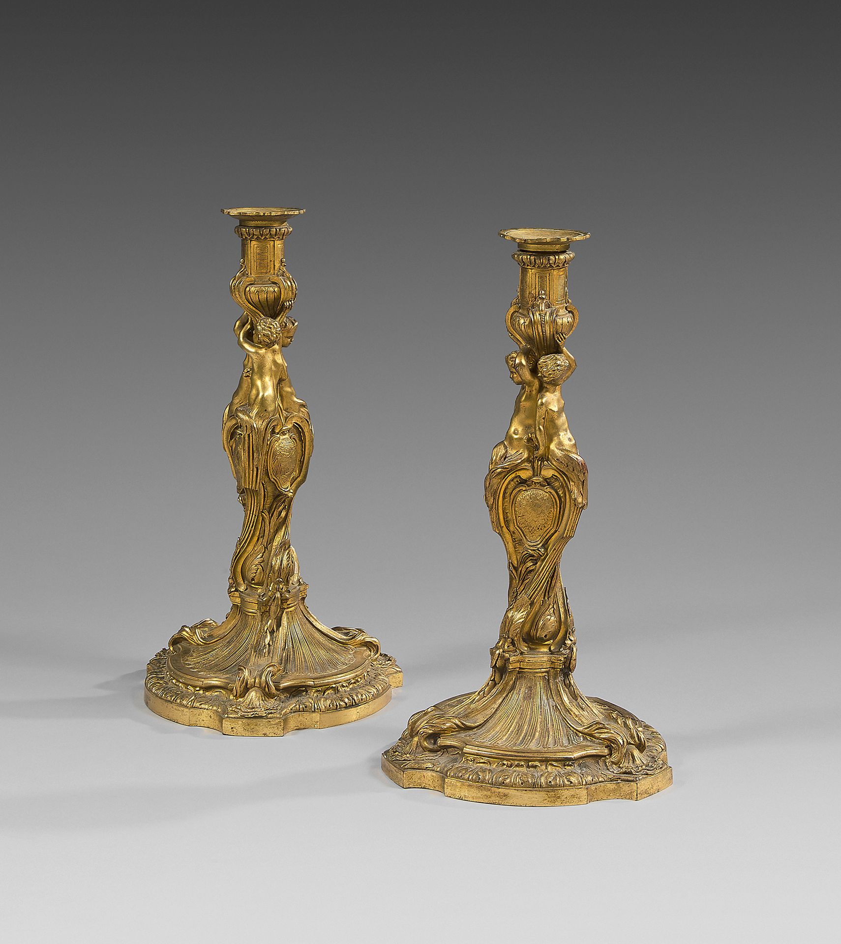 Null A pair of large chased and gilt bronze torches; the shafts in the form of t&hellip;