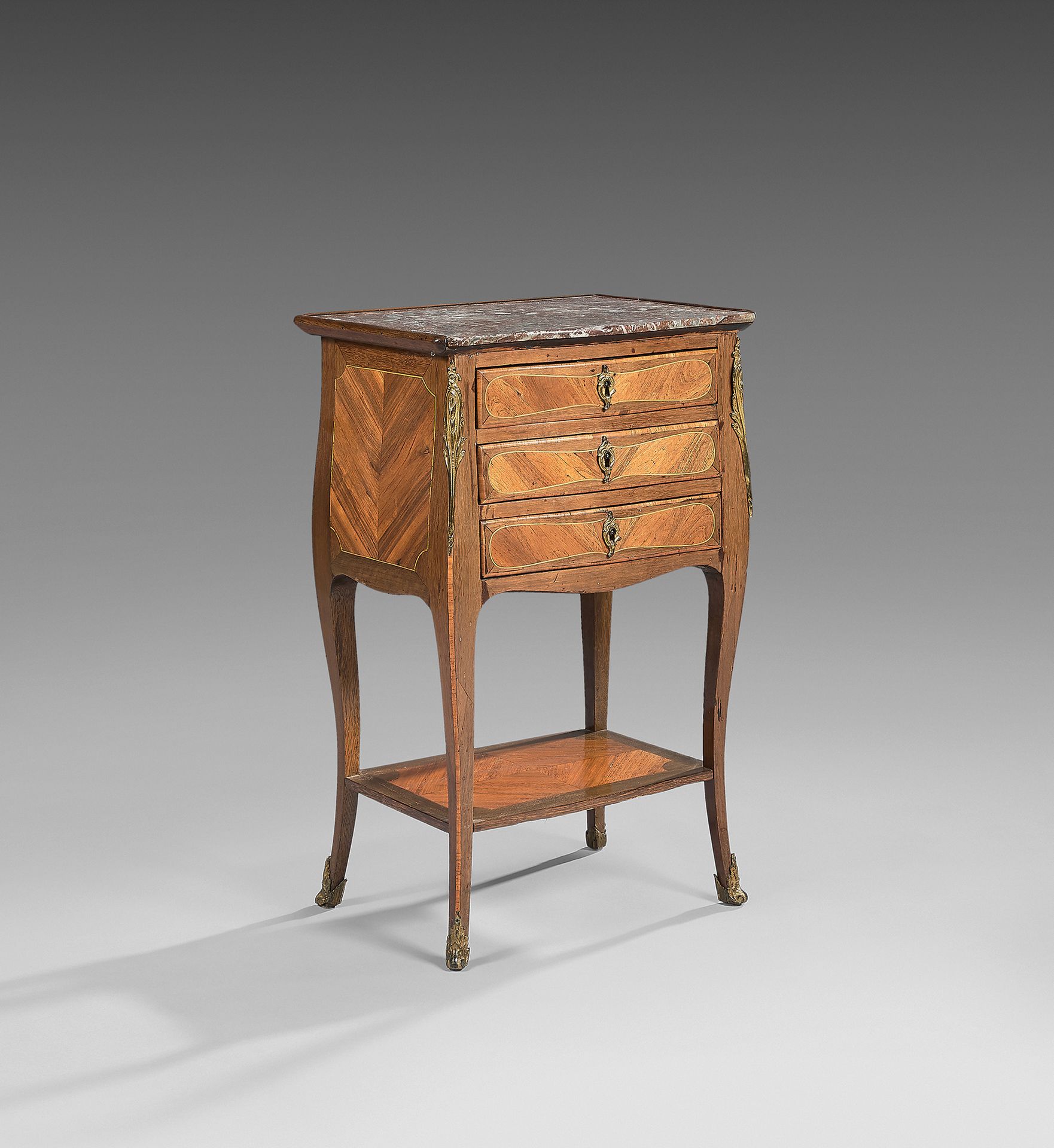 Null Table called "chiffonnière" inlaid with rosewood in frames of amaranth; it &hellip;