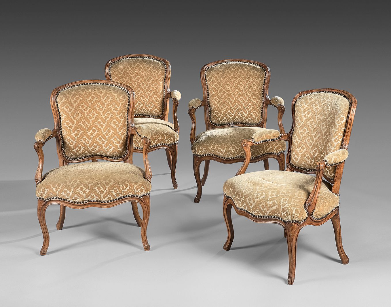 Null Suite of four cabriolet back armchairs in moulded beech; whiplash shaped ar&hellip;