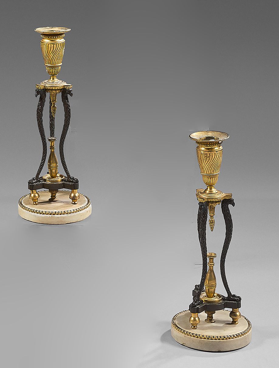 Null A pair of chased bronze, ormolu or patinated and white marble candlesticks;&hellip;