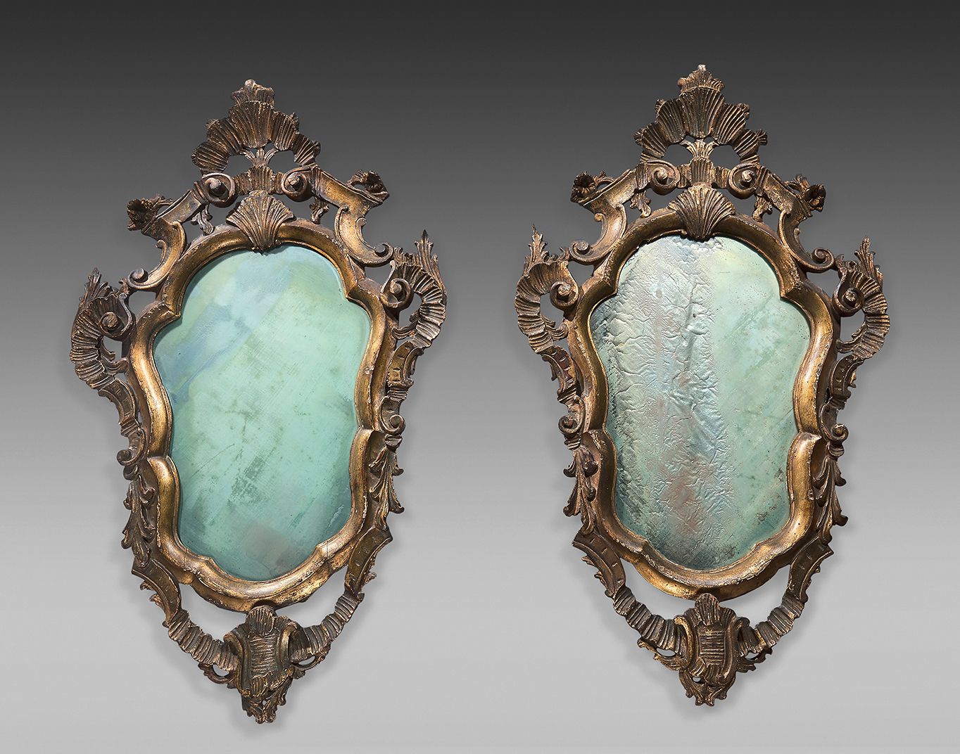 Null Pair of molded, carved and gilded wood reflectors with baroque scrollwork, &hellip;