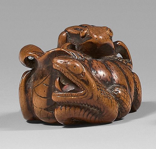 JAPON - Époque Edo (1603-1868), XIXe siècle 黄杨木网饰，南瓜上的青蛙，一条蛇从里面出来。带有友信的签名。
长：4.5&hellip;