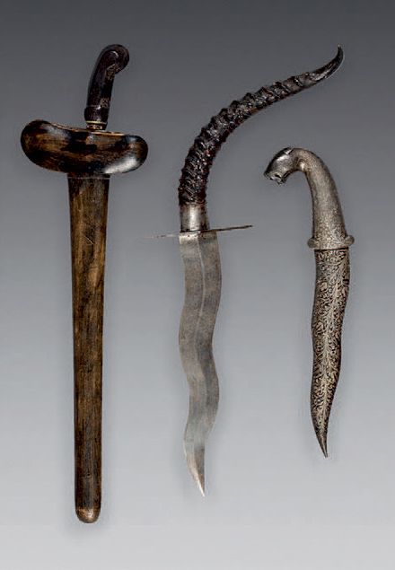 Null Lot including :
Khandjar dagger decorated with silver flower scrolls, wavy &hellip;