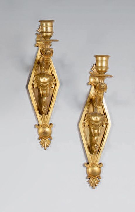 Null Pair of one-light sconces in chased and gilded bronze; the diamond-shaped p&hellip;