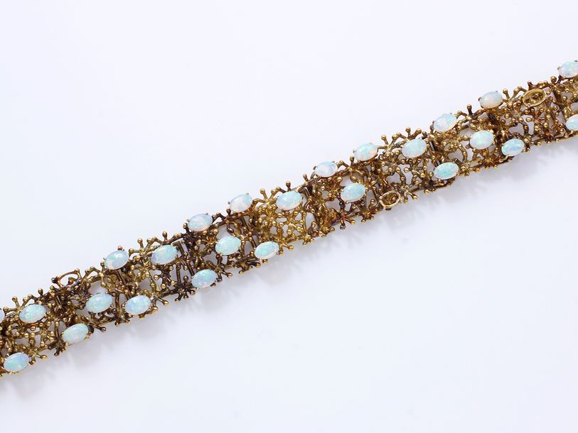 Null Bracelet articulé en or 585 millièmes décoré de cabochons d’opales posés su&hellip;