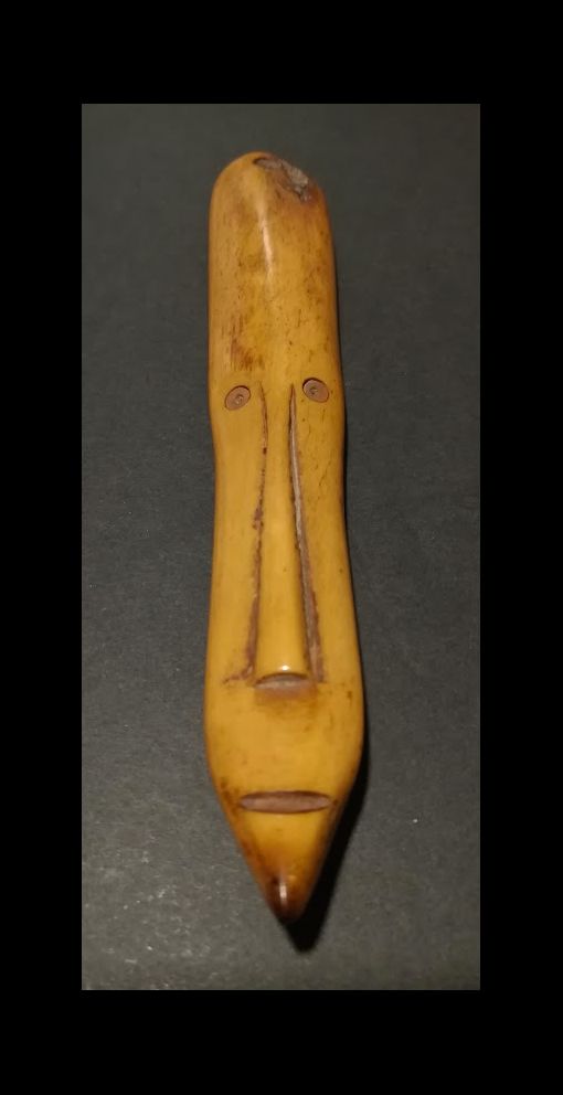 Null Passport mask. West Africa. Carved bone. Approx 6/9CM.