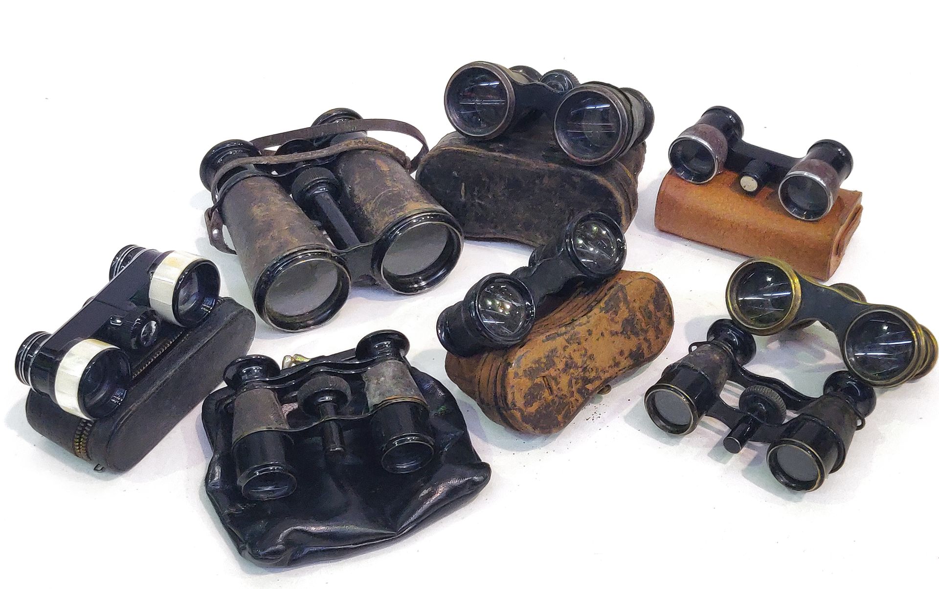 Null Set of eight pairs of various binoculars.