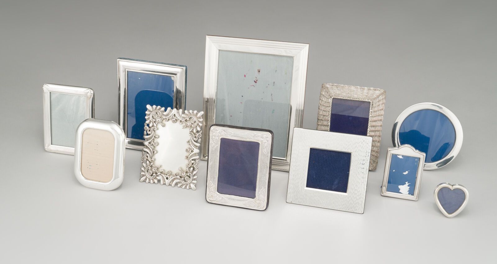 Null Set of eleven silver plated metal photo frames, two of which are signed CHR&hellip;