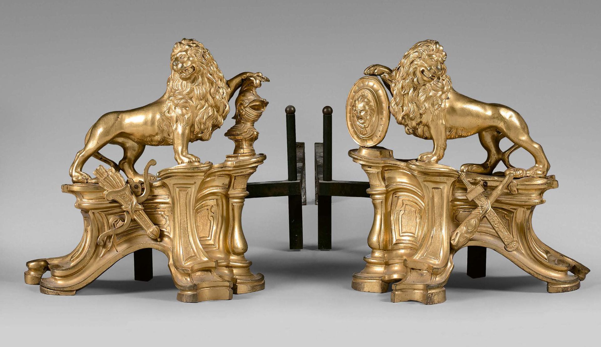 Null Pair of gilded bronze andirons decorated with heraldic lions on a rocaille &hellip;