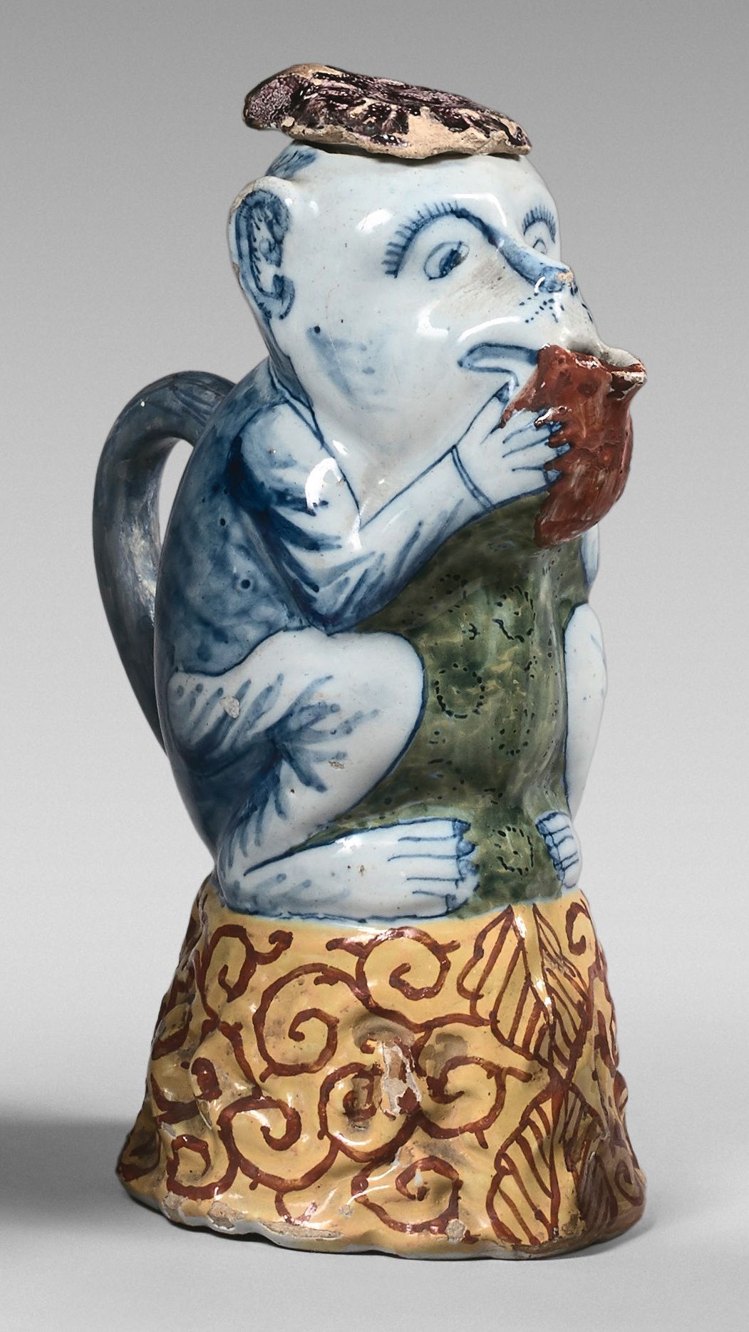 DELFT Pitcher in the shape of a monkey sitting on a yellow base decorated with s&hellip;