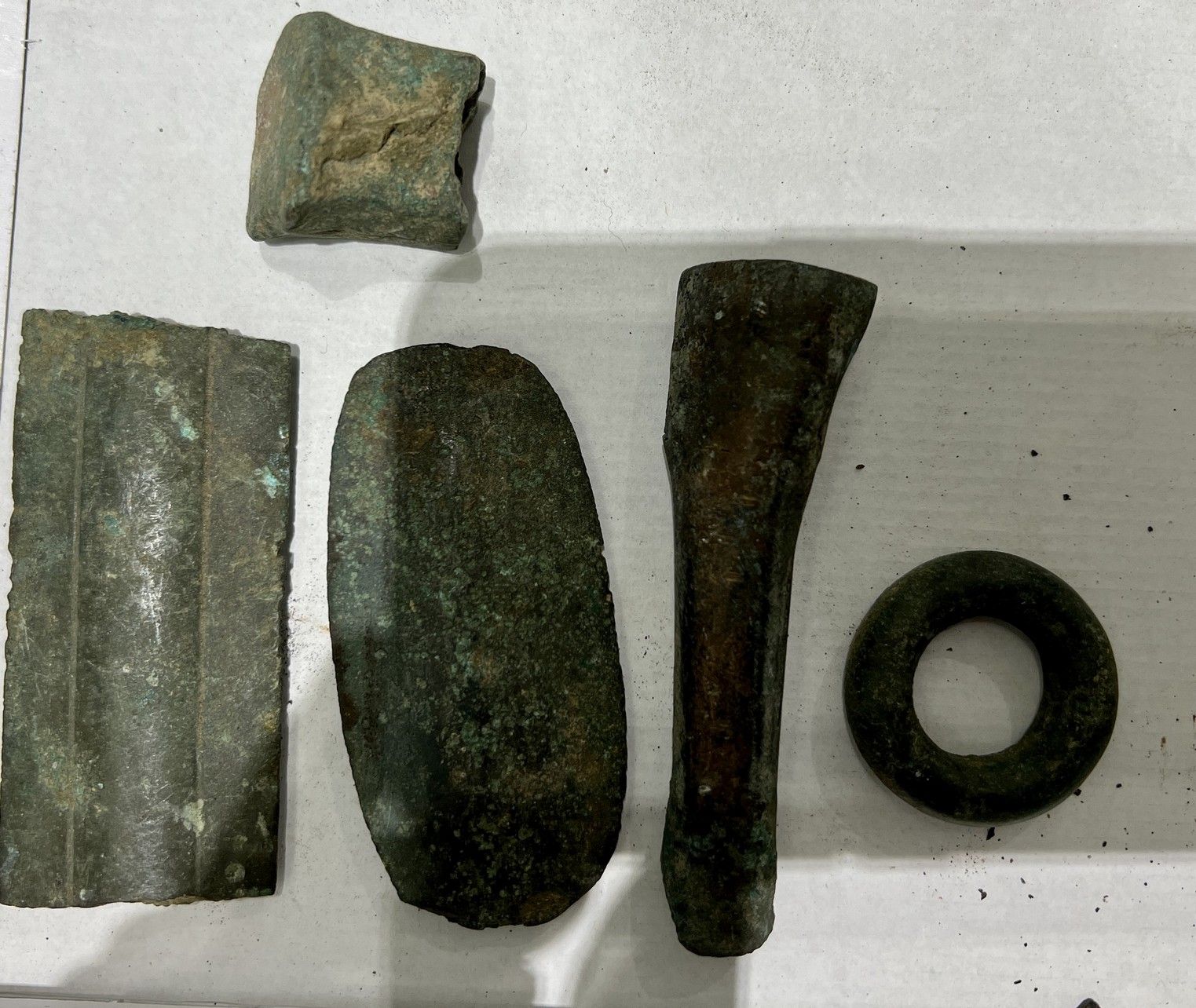 Null 
Lot including a fragment of a sword blade, a socket gouge, a half ring wit&hellip;