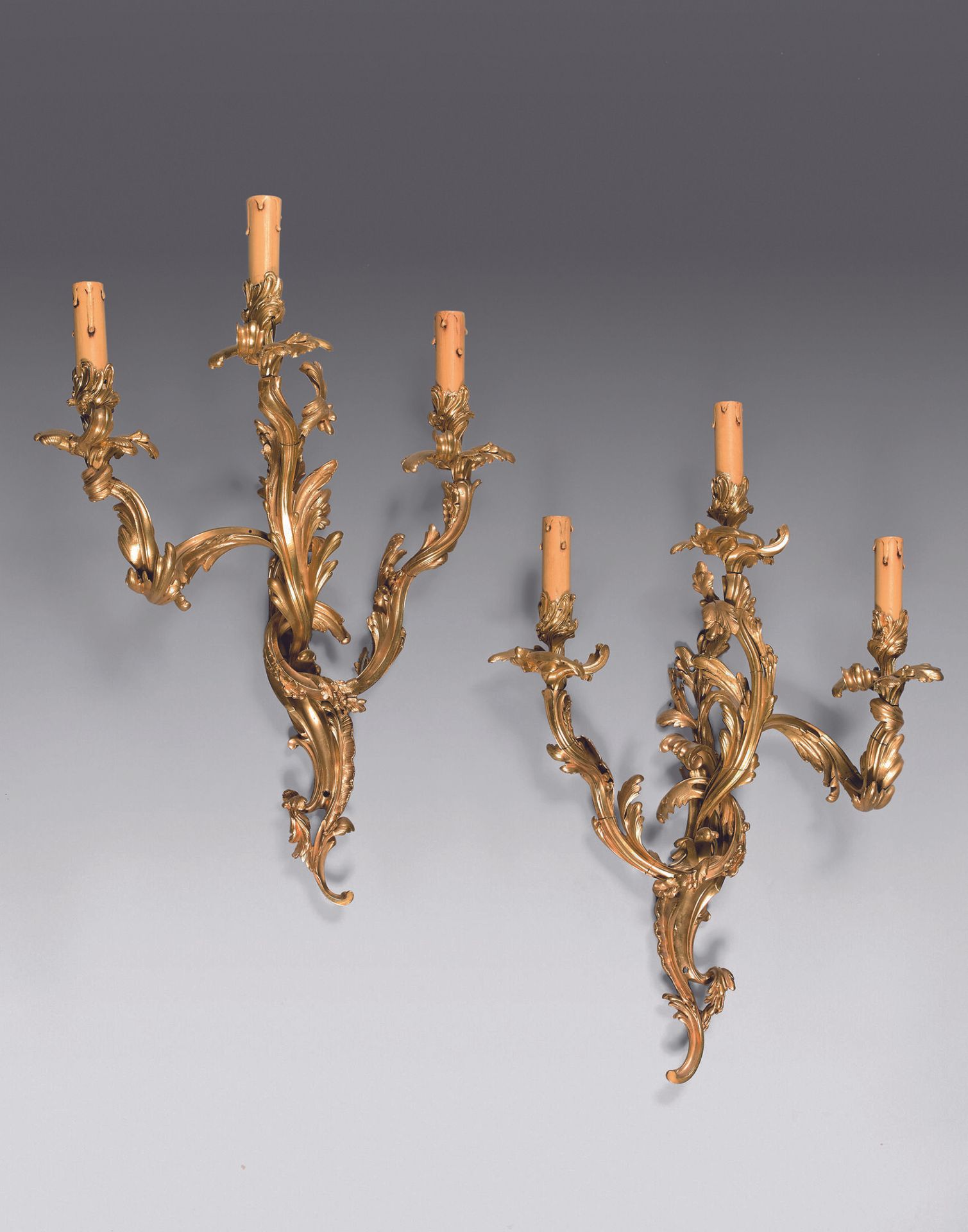 Null Pair of large ormolu sconces with three asymmetrical lights with foliage. 
&hellip;