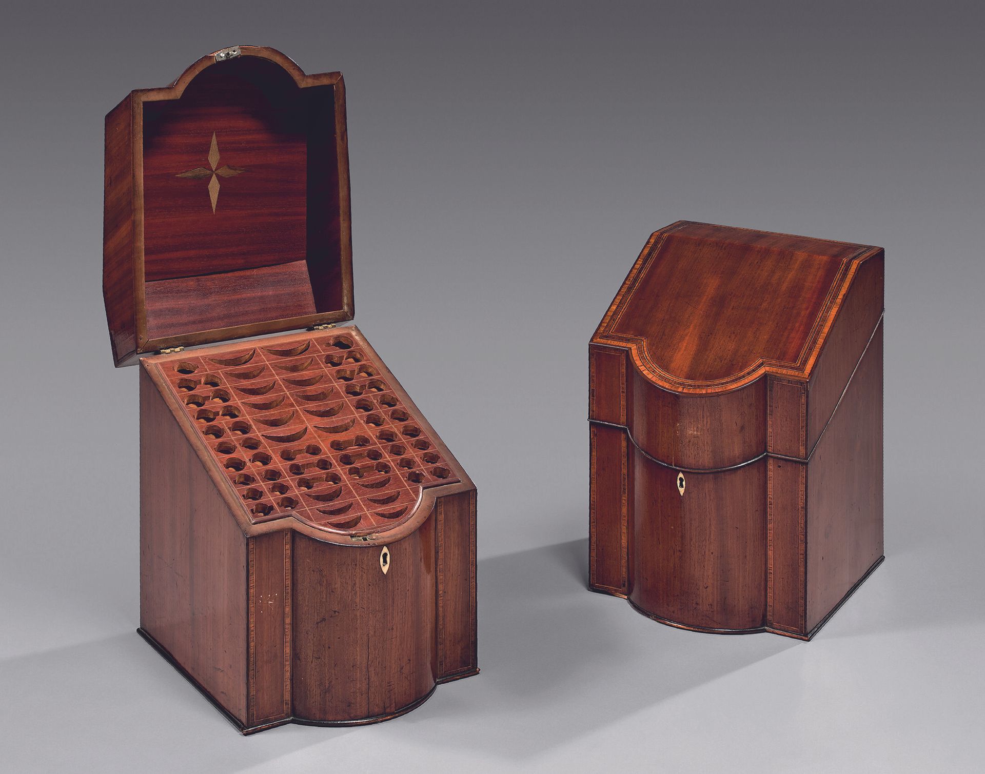 Null Pair of mahogany cutlery boxes with curved front and sloping lid. Star inla&hellip;