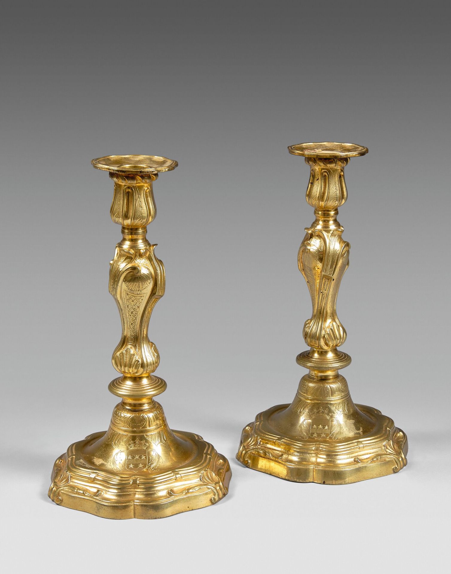 Null Pair of large ormolu candlesticks with rocaille decoration, engraved with c&hellip;