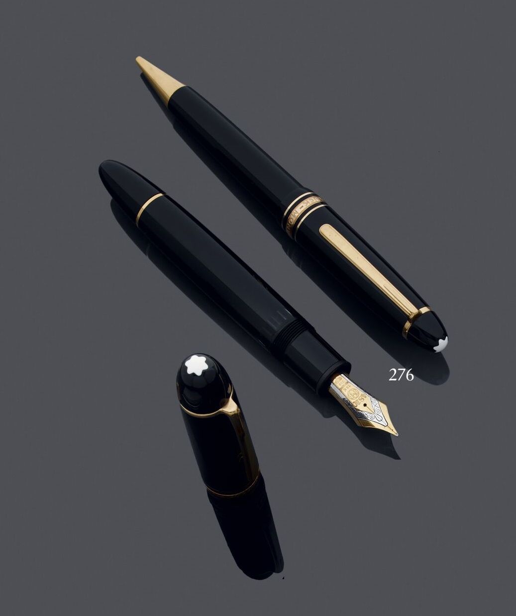 Null Montblanc-Meisterstuck
Metal and black lacquered fountain pen and criterium&hellip;