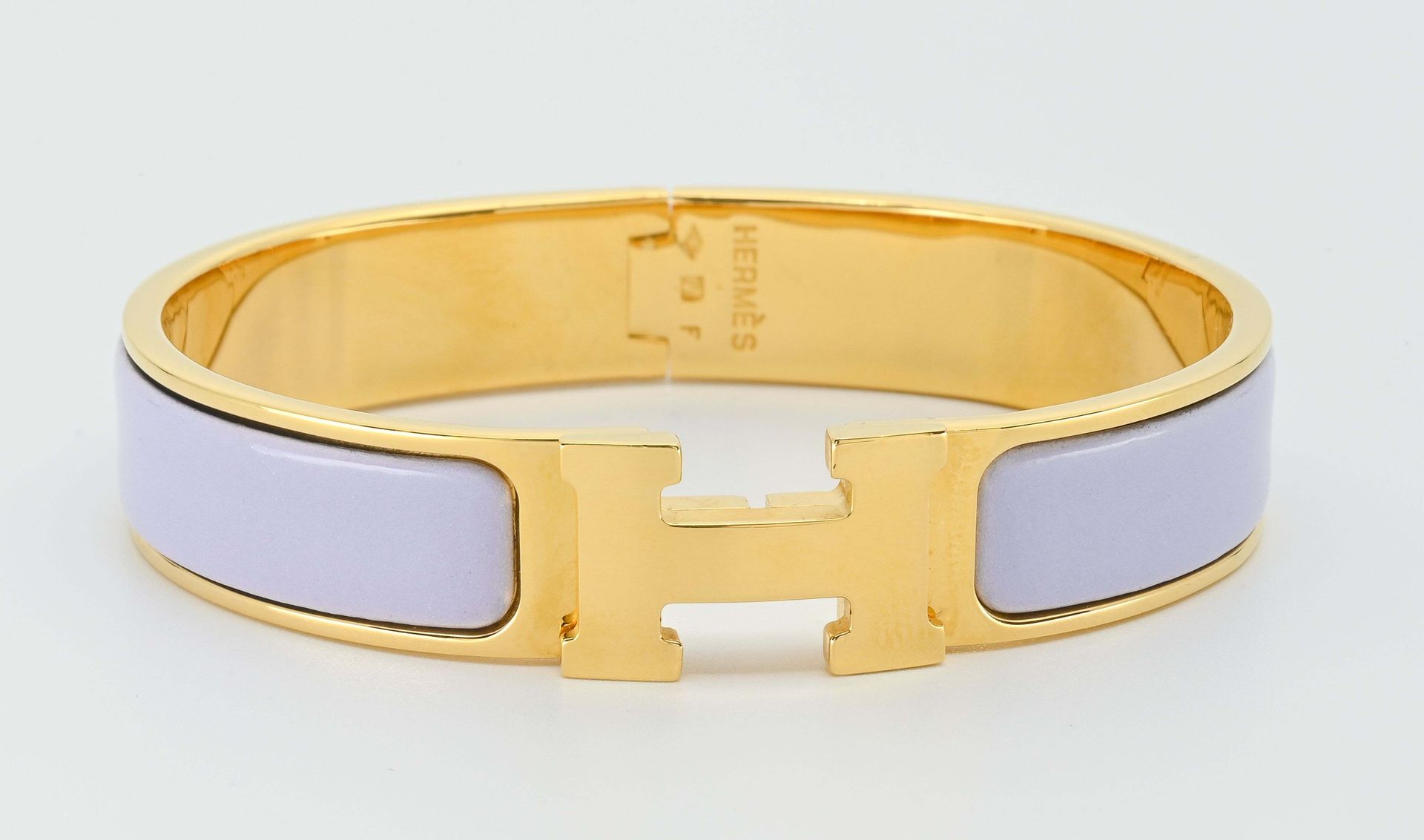 Null 
HERMES. H-click bracelet in gilt metal and parma enamel.

Inside diameter &hellip;