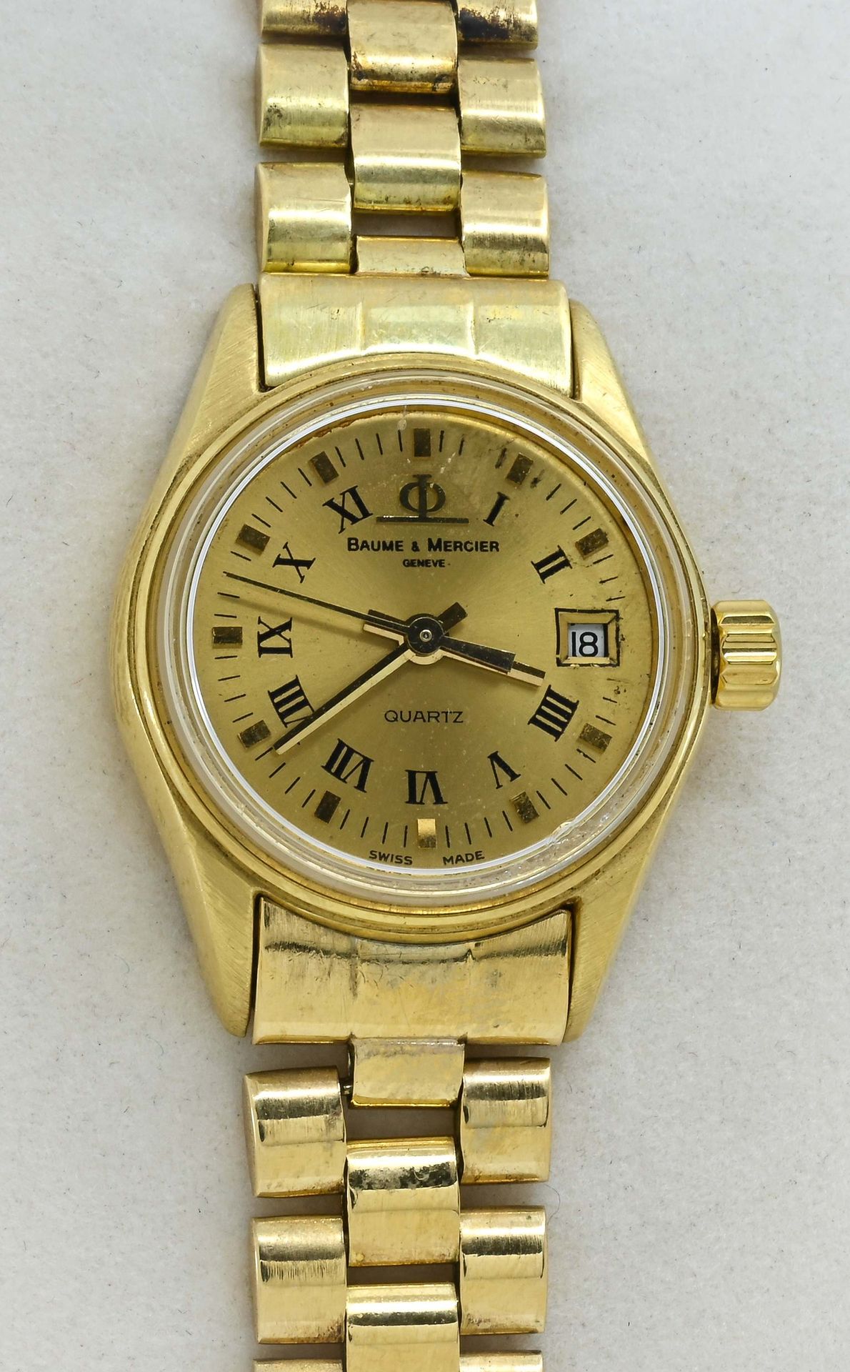 Null 
Baume & Mercier.女士腕表，表壳24毫米，带折叠扣的表带

在黄金750°°。2010年的参考文献73207。 

金色表盘，罗马数字&hellip;