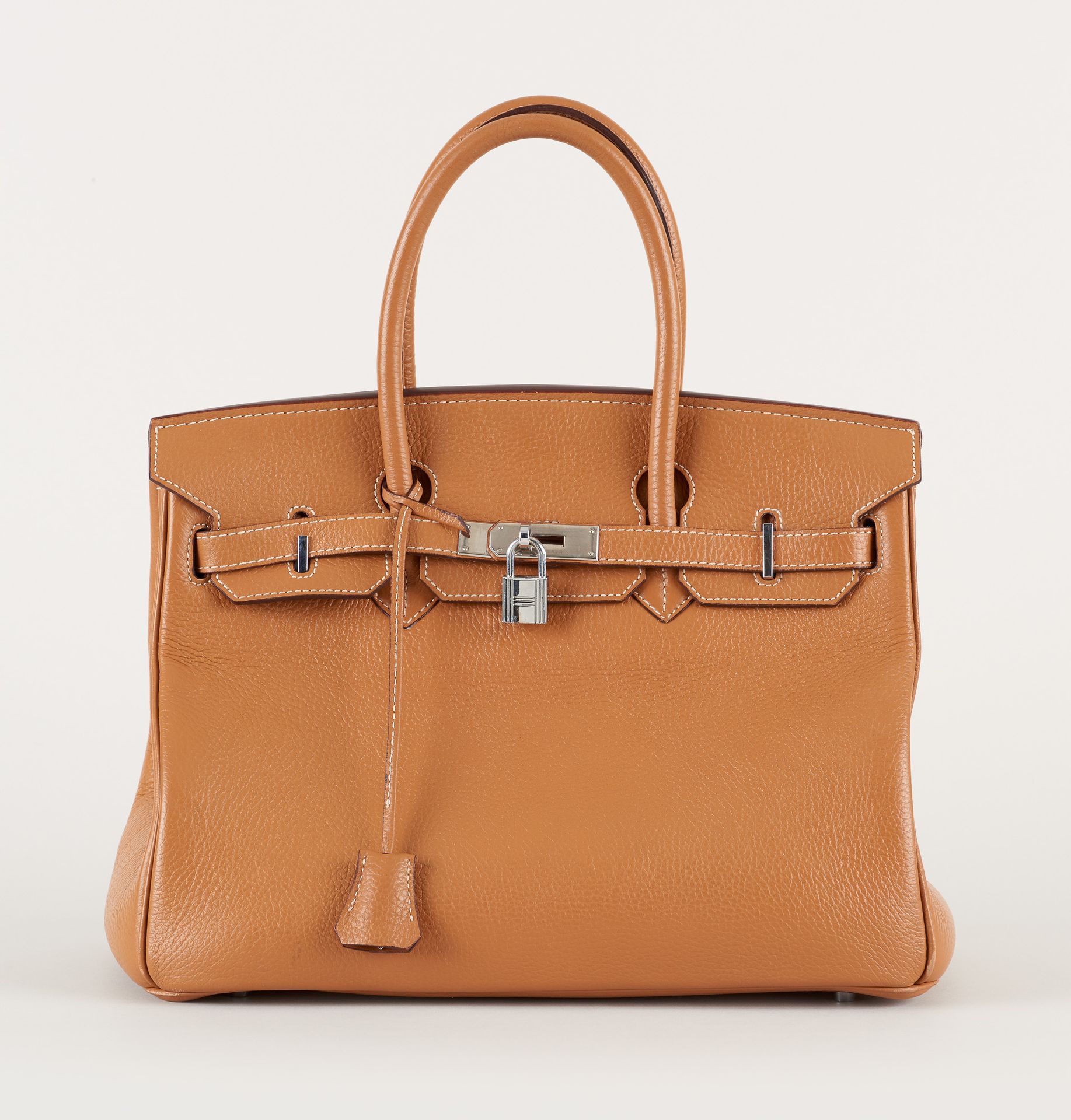 HERMES. Leather goods: Handbag in grained leather, cognac color.

From Hermès, "&hellip;