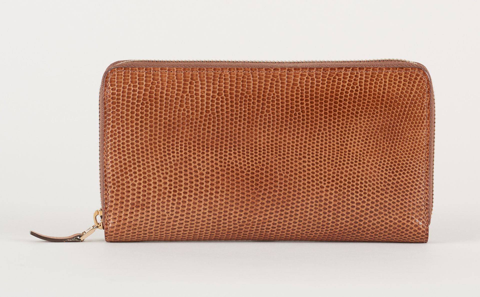 Delvaux. Lederwaren: Brieftasche aus hellbrauner Eidechse.

Marke Delvaux.

Größ&hellip;
