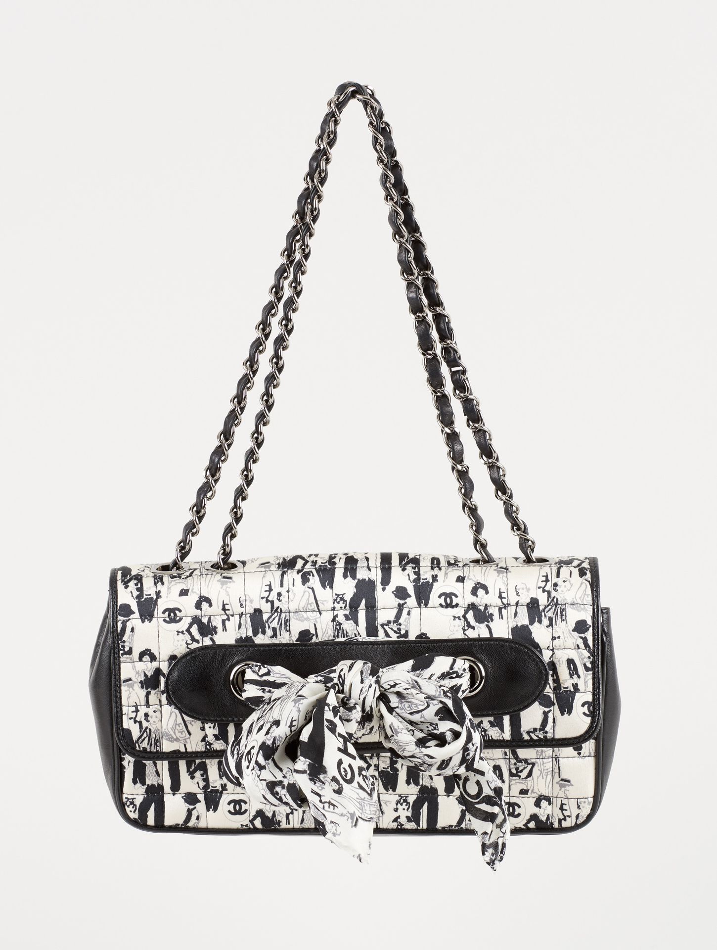 CHANEL. Leather goods: Black leather and silk handbag with young women prints.

&hellip;