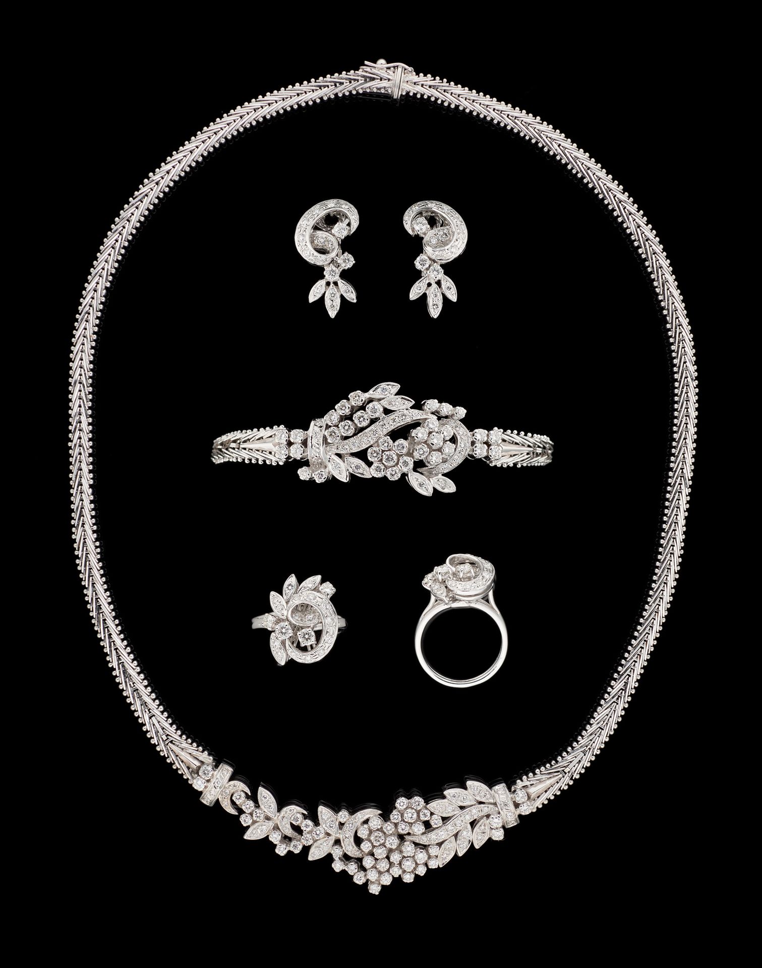 Joaillerie. Jewelry: Set in white gold, consisting of a necklace, a bracelet, a &hellip;