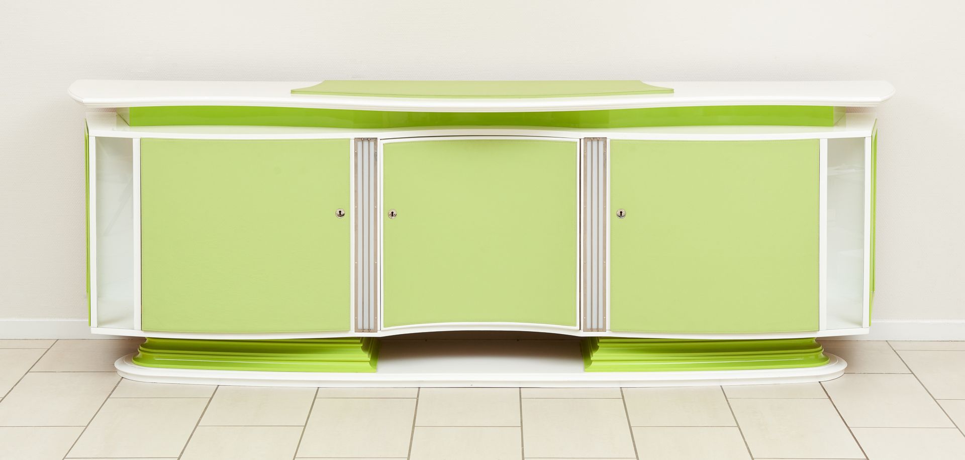 Design. Piece of furniture: Dressoir with three curved solid doors, the central &hellip;