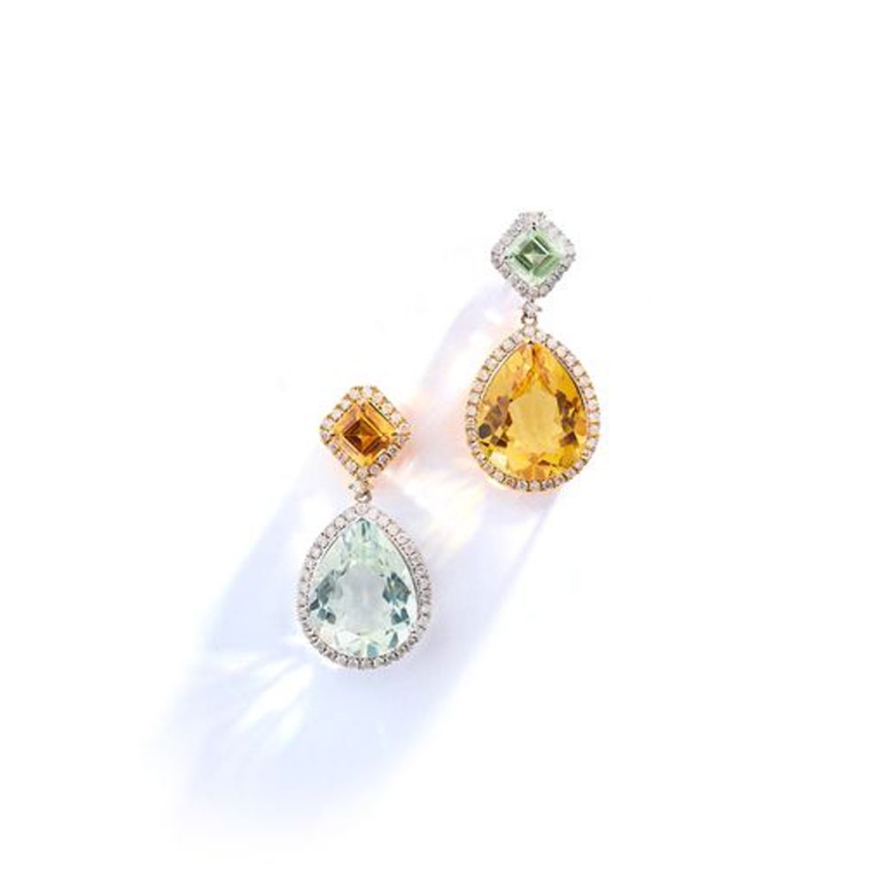 A pair of gem-set earrings Of opposing design, each pear-shaped drop set with ei&hellip;