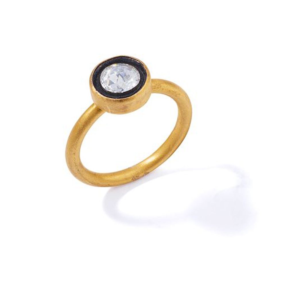 A diamond single-stone ring The rose-cut diamond collet-set within a black ename&hellip;