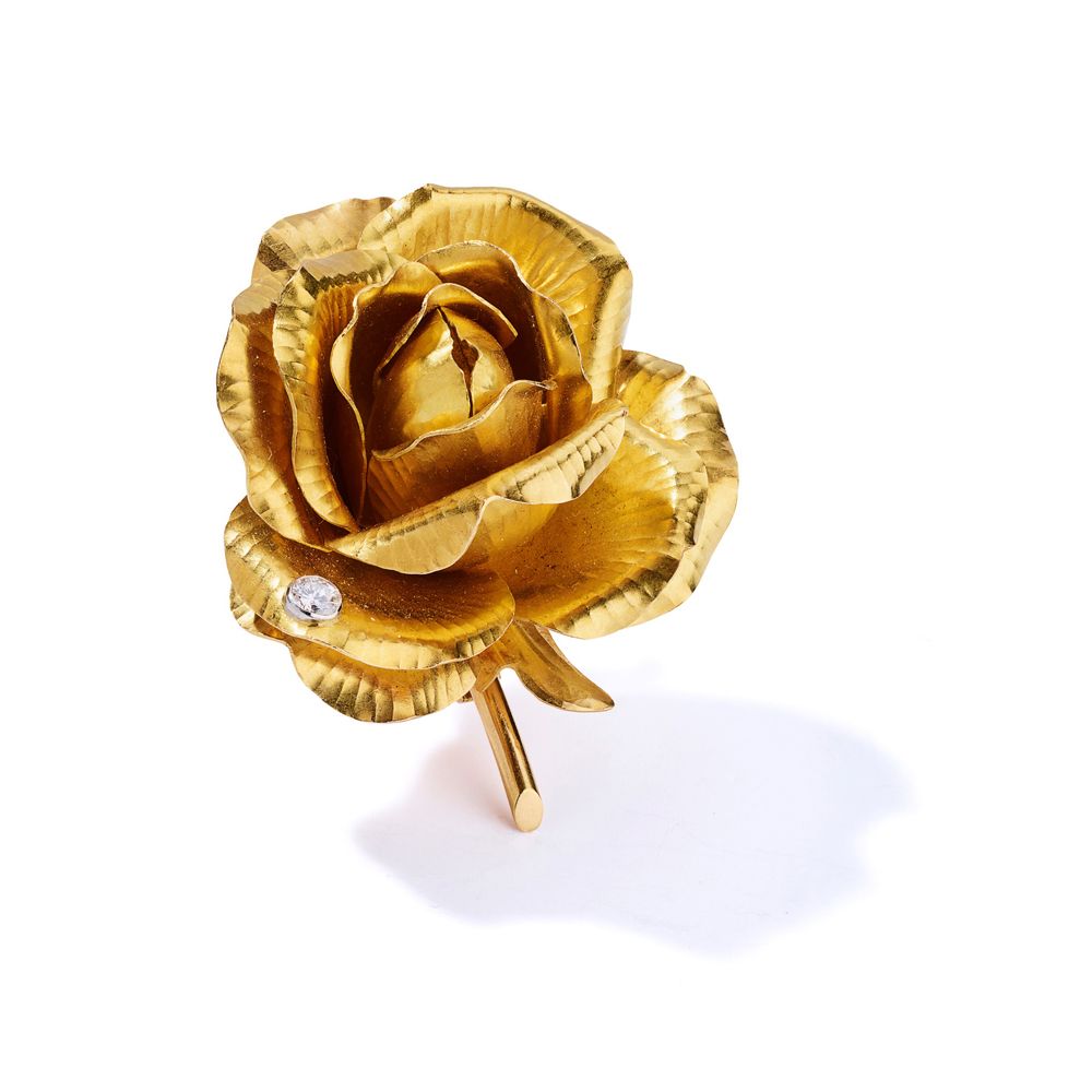 Cartier: A diamond-set flower brooch, 1961 Modelled as an 18ct gold rose, accent&hellip;