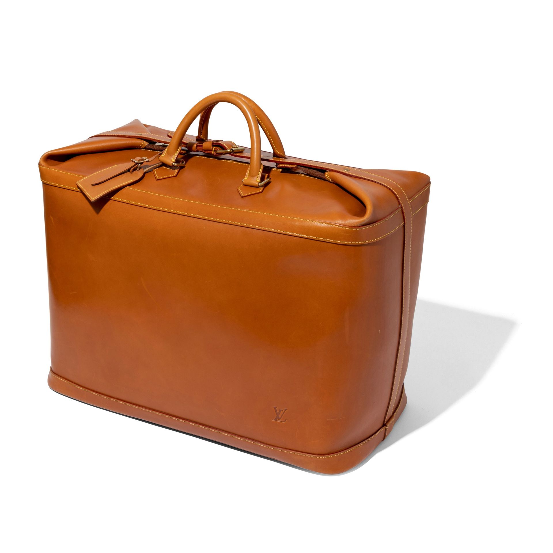 Louis Vuitton: A tan leather Nomade Cruiser 50 Tan leath…