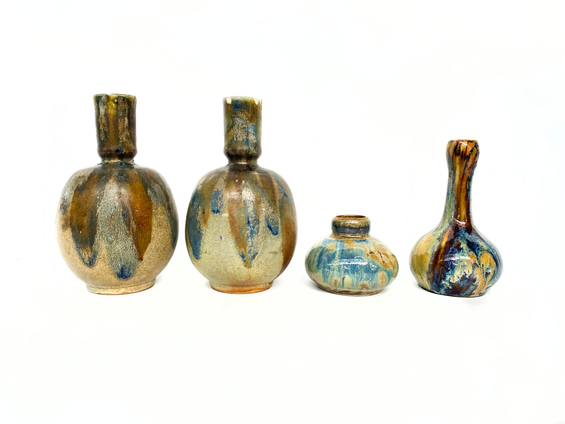 Null Charles GREBER (1853 -1935) 

Lot de quatre vases soliflores en grès emaill&hellip;