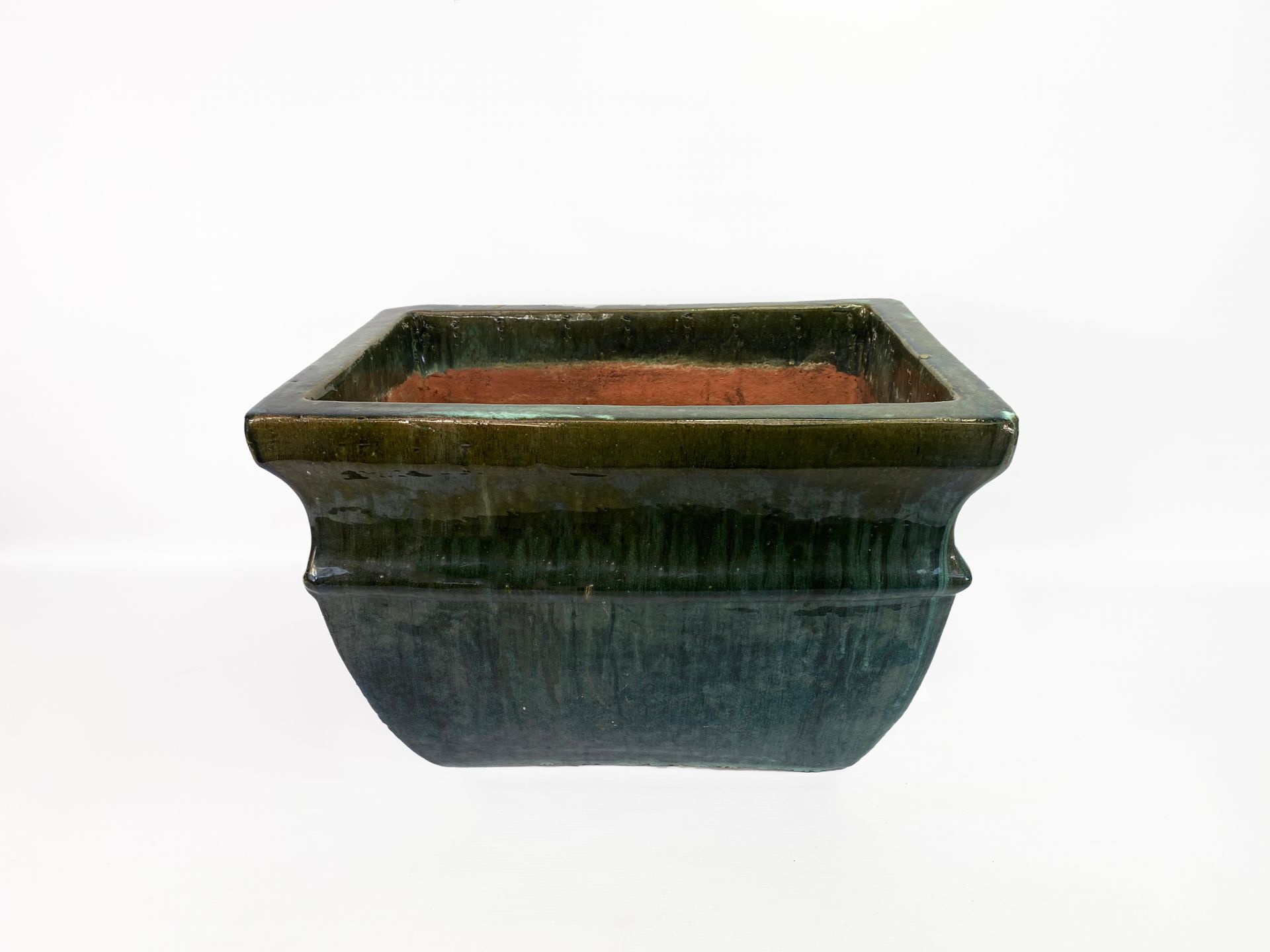 Null Important ceramic planter with enamelled decoration of green coulures.

H. &hellip;