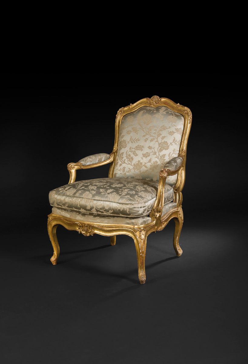 Null *A moulded, carved and gilded beechwood armchair with a flat back, decorate&hellip;