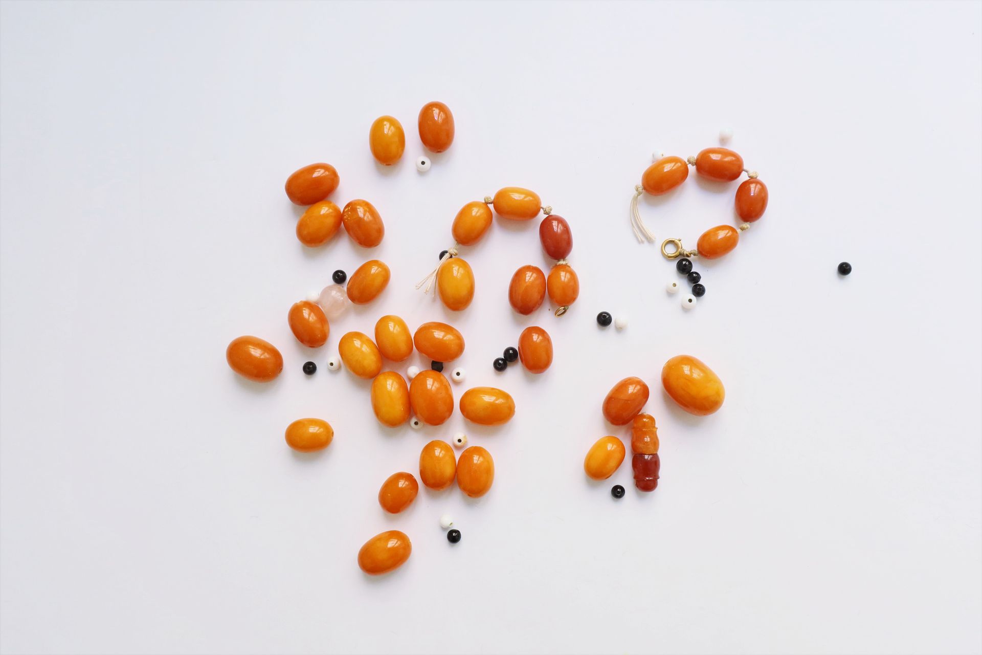 Null Set of oblong amber balls, white or black glass beads.