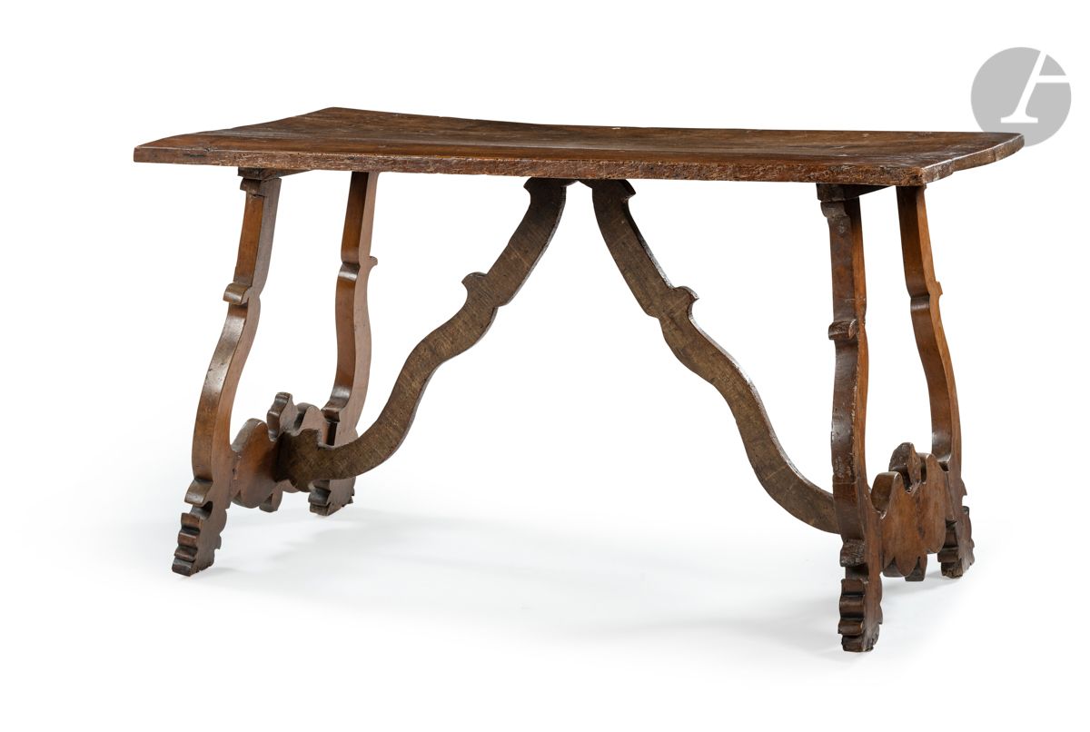 Null A walnut skirted table with openwork base, the rectangular top; (accidents &hellip;
