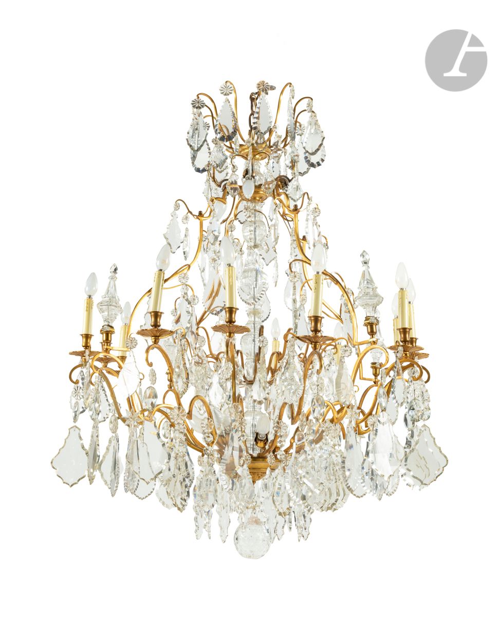Null A large ormolu and cut glass chandelier with twelve lights and decoration o&hellip;