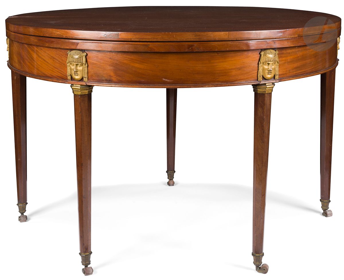 Null A circular mahogany table, with a double top, one forming a game table, the&hellip;