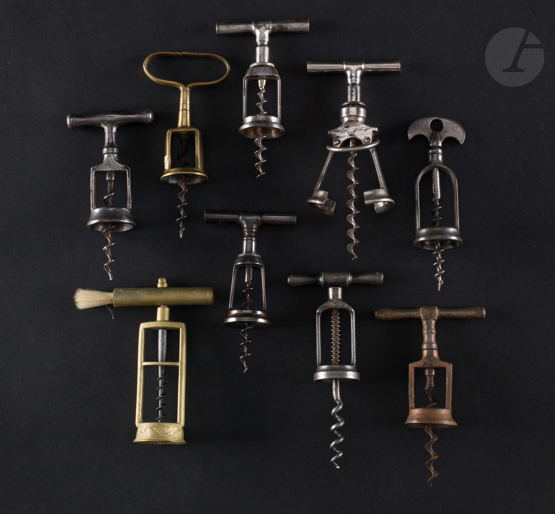 Null Nine simple corkscrews with iron or brass cage.

Marked "CL", "THE SURPRISE&hellip;
