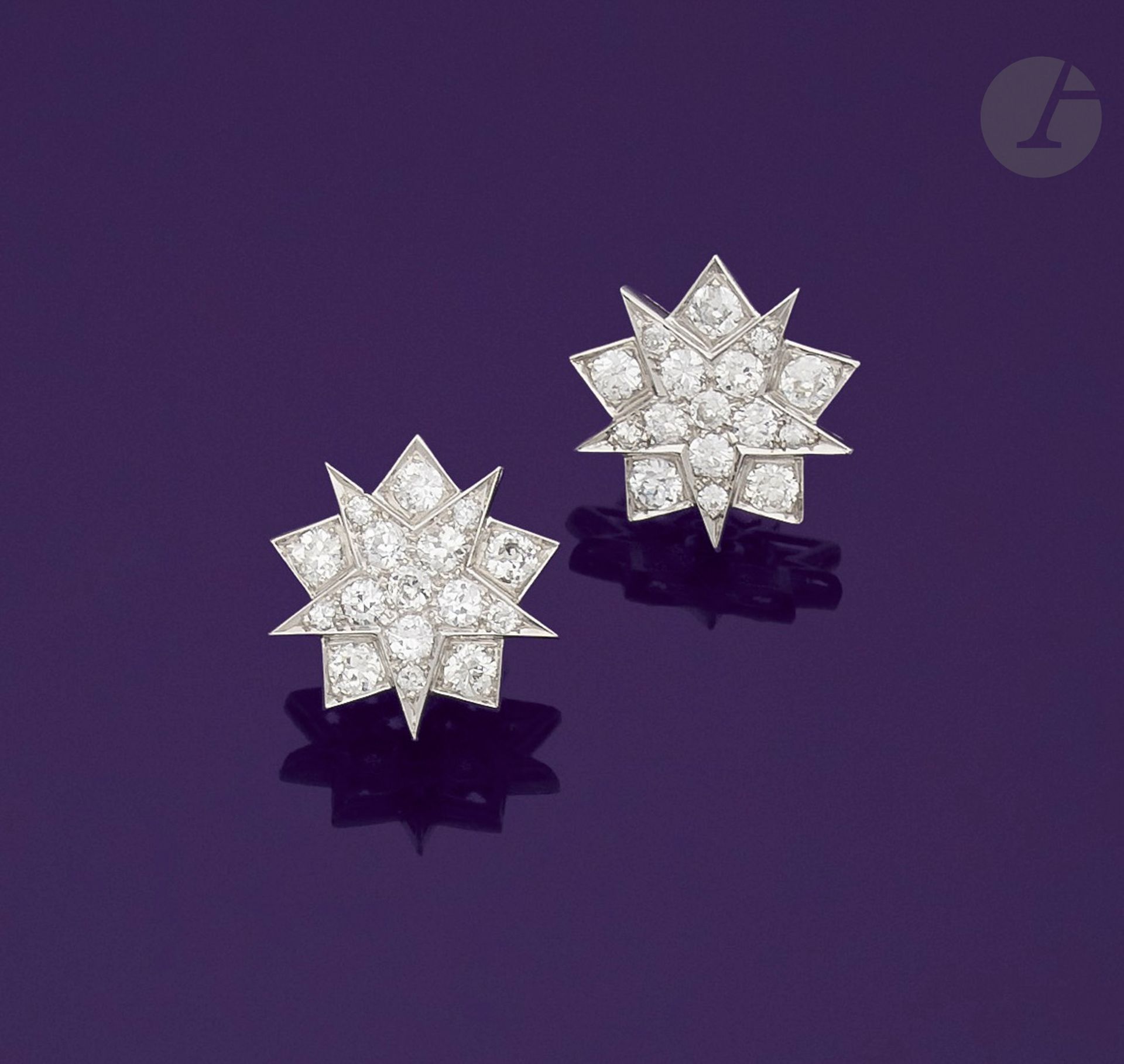 Null Pair of platinum ear clips drawing stars, each paved with old cut diamonds.&hellip;