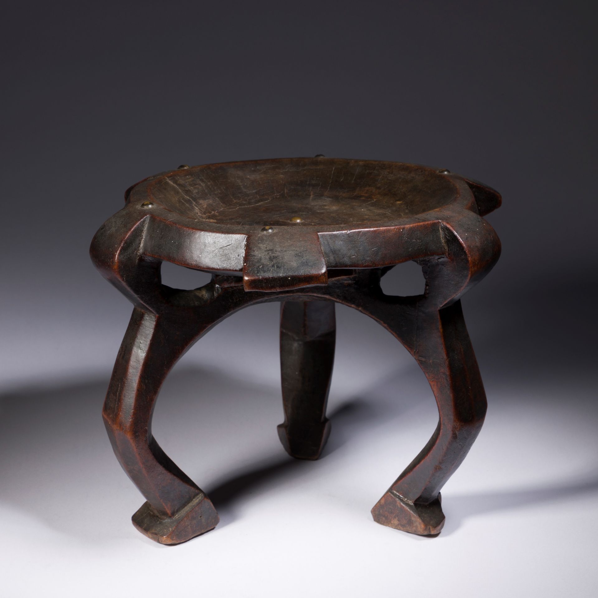 Null *An old and very beautiful small tripod stool decorated with upholsterer's &hellip;