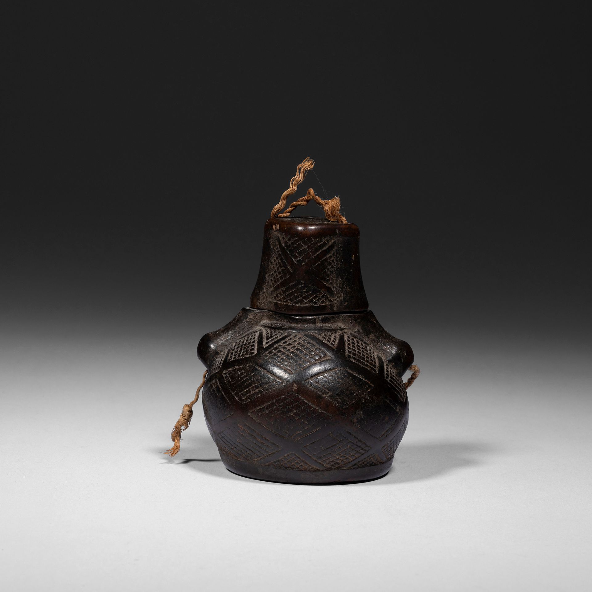 Null An old classic powder flask with engraved patterns.

Bakongo, Democratic Re&hellip;